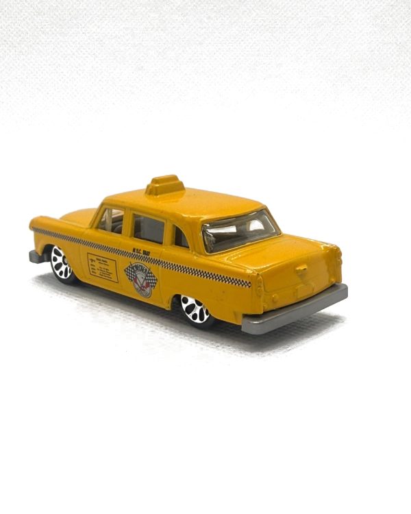 yellow_taxi_rear_angle_white_1122x1402 (1) Matchbox Checker Special Cab New York City Taxi Yellow ‘60’s 70’s Diecast 1:62